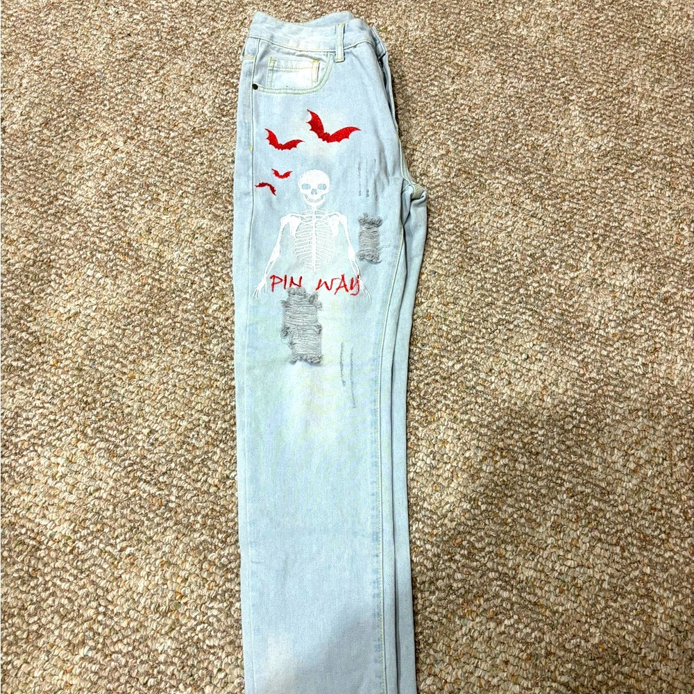 Light blue jeans with red graphic
